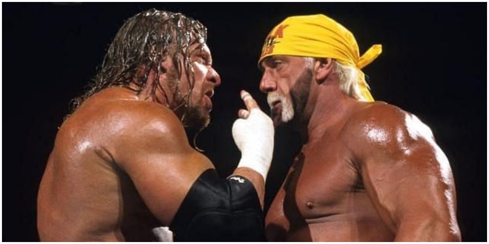 Triple H and Hulk Hogan facing off in the ring