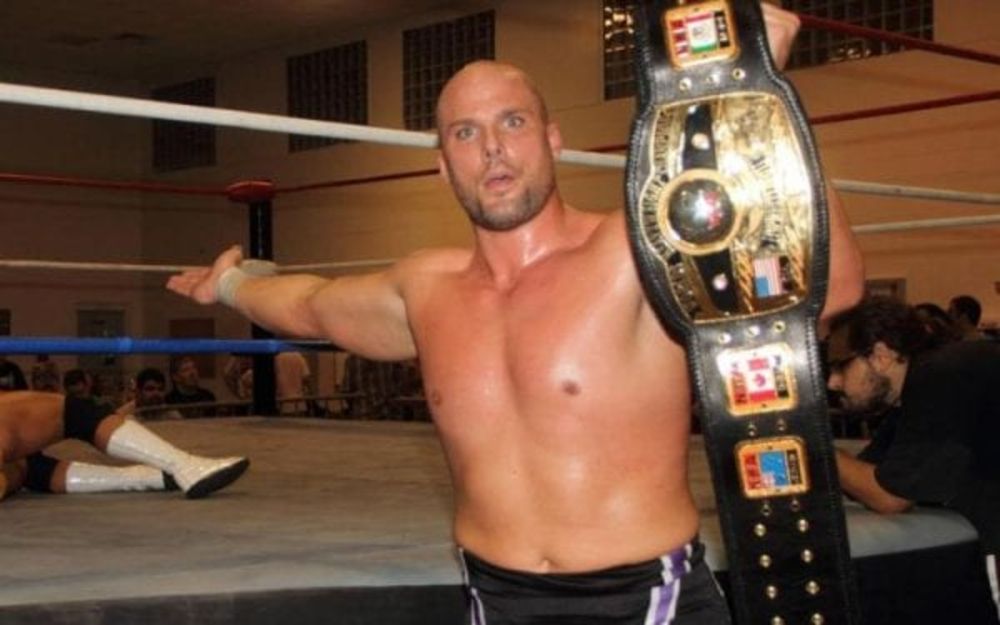Adam Pearce with the NWA World Title