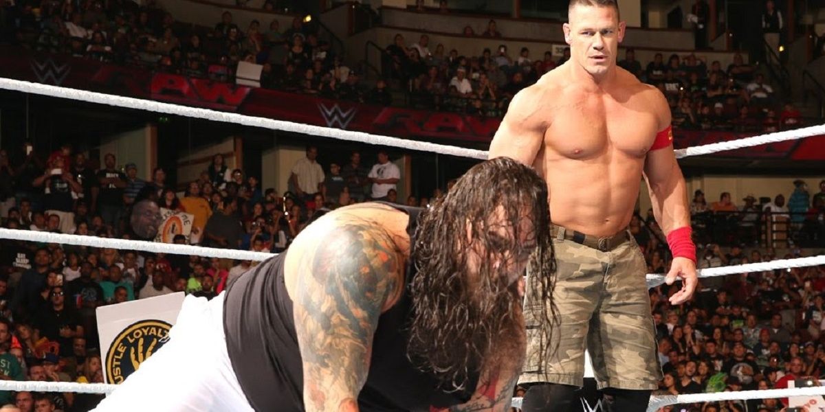 John Cena stares down Bray Wyatt in 2014. 