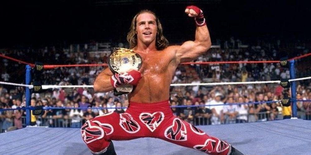 Shawn Michaels posing with the WWE title