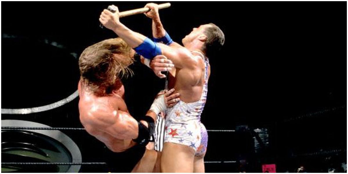Kurt Angle hitting Triple H with sledgehammer