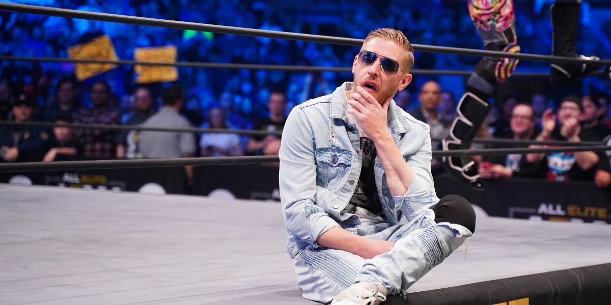 Orange Cassidy sitting on the ring apron for AEW