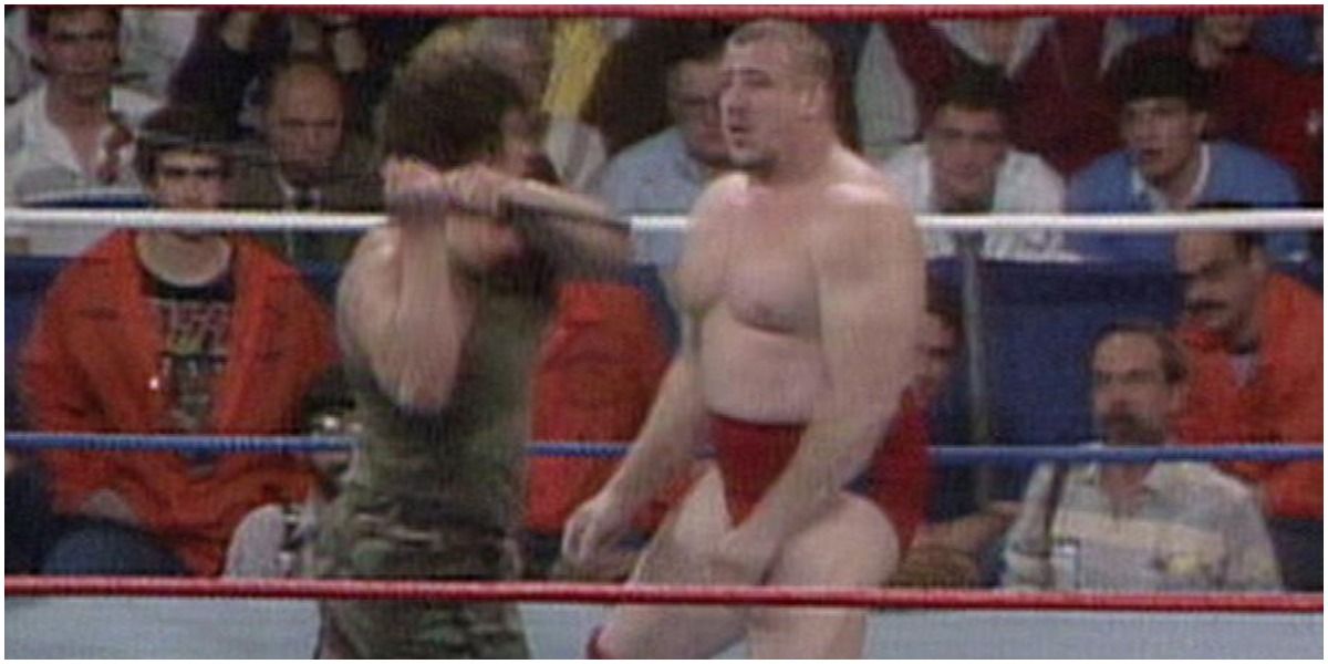 WWE Corporal Kirchner Swinging An Object At Nikolai Volkoff