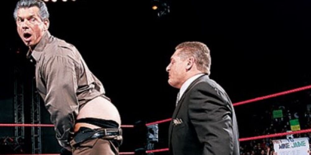 William Regal readying to kiss Vince McMahon's ass.