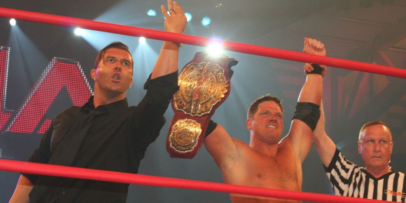 AJ Styles holding is title with Kazarian.