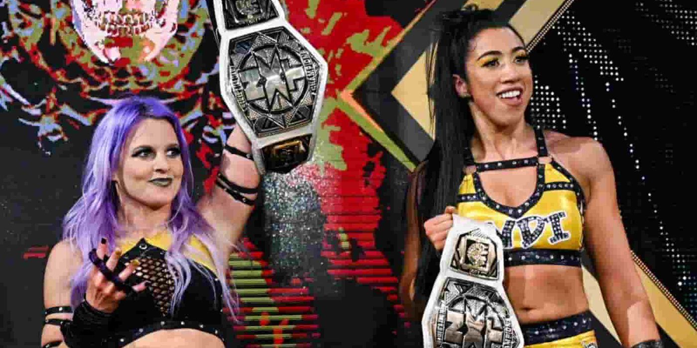 Candice LeRae &amp; Indie Hartwell holding up their NXT tag titles.
