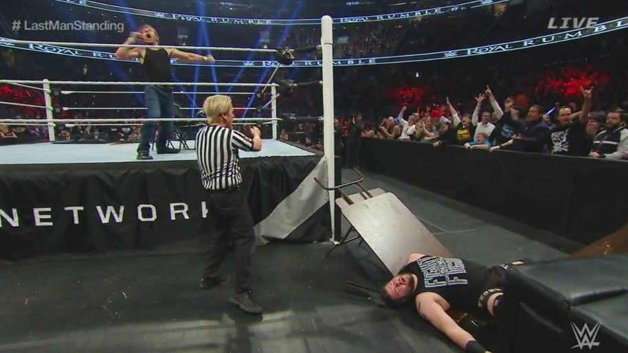 Dean Ambrose sends Kevin Owens through a stacked table