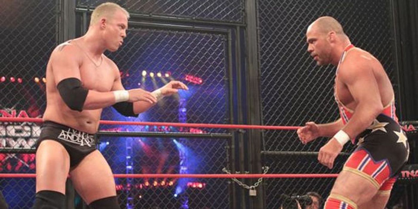 Kurt Angle and Mr Anderson prepare to fight in a cage.