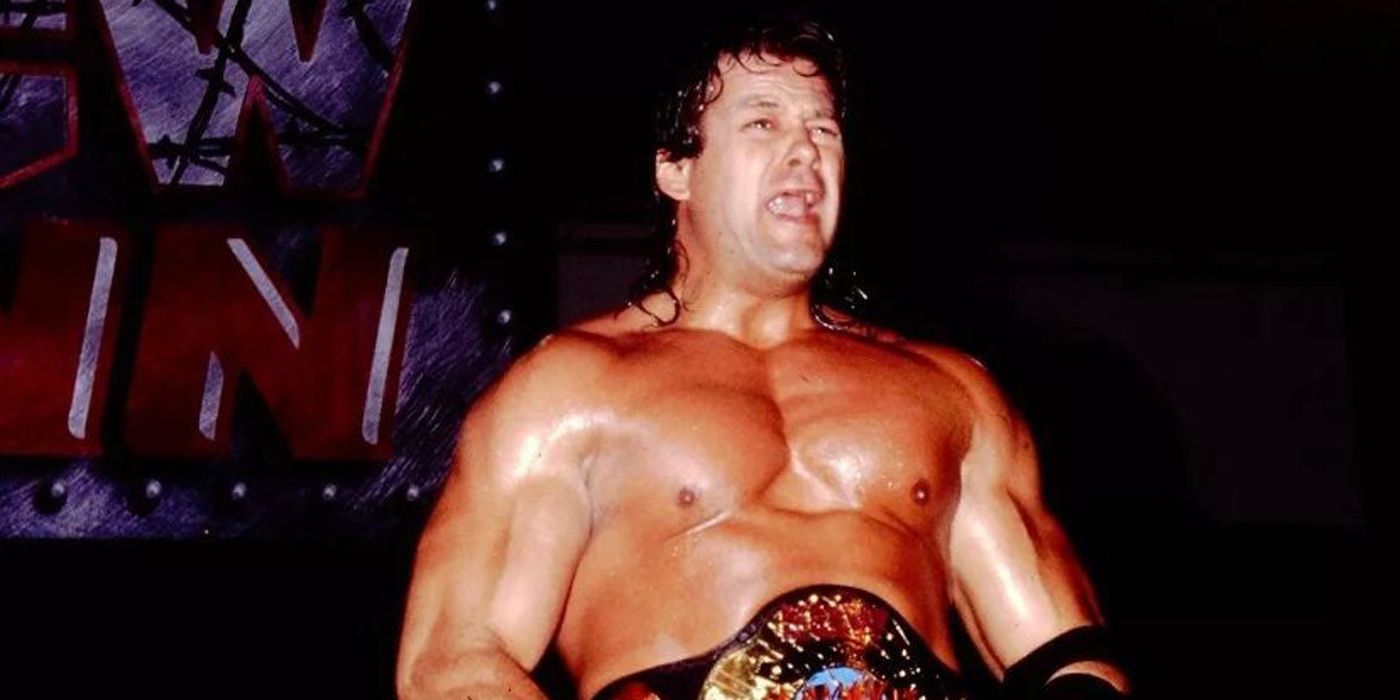 Mike Awesome celebrating with a WCW title.