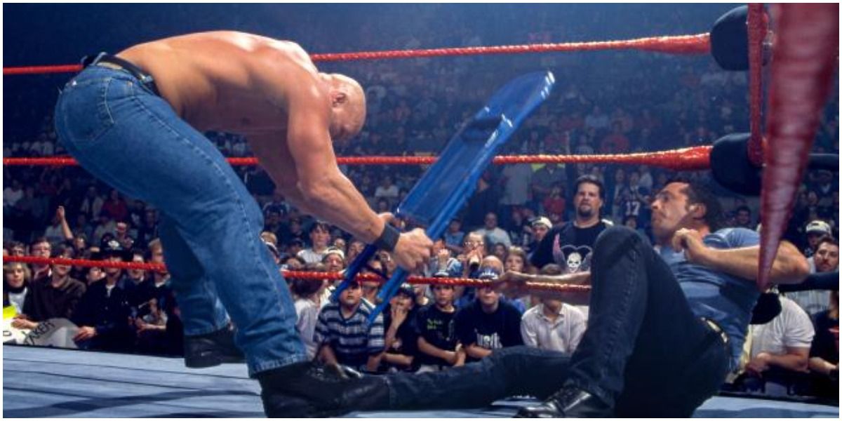 Steve Austin hitting Bret Hart with a chair