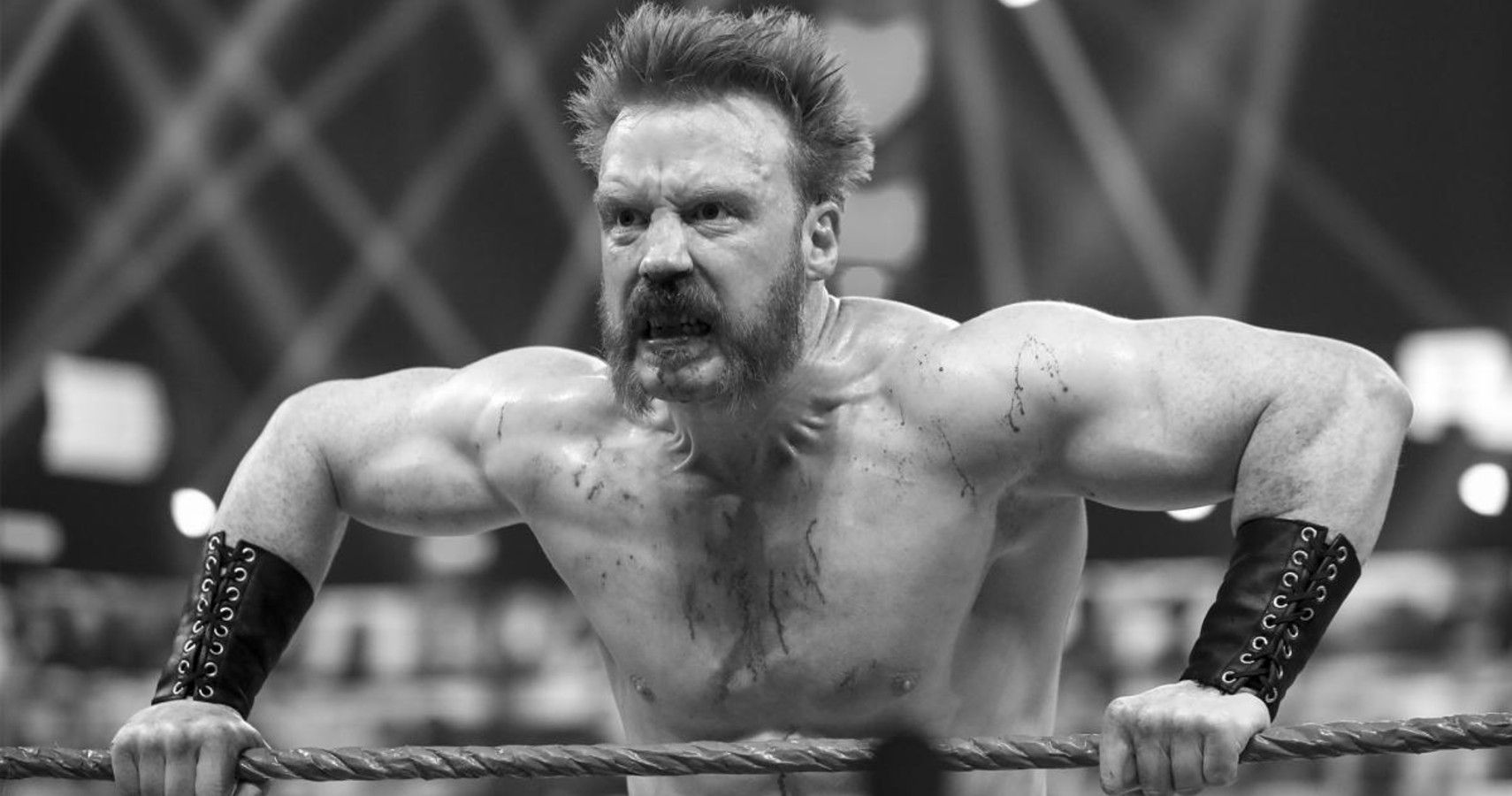 WWE Superstar sheamus leaning over the ropes 