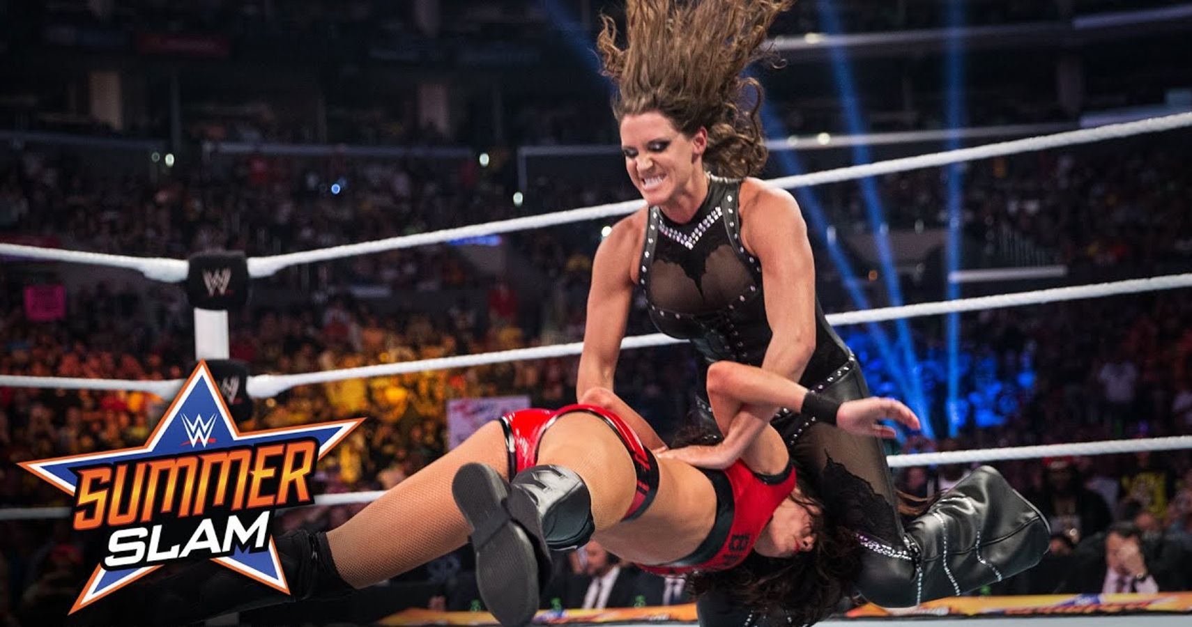 WWE's Chief Brand Officer Stephanie McMahon performs a Pedigree on Brie Bella at SummerSlam 2014