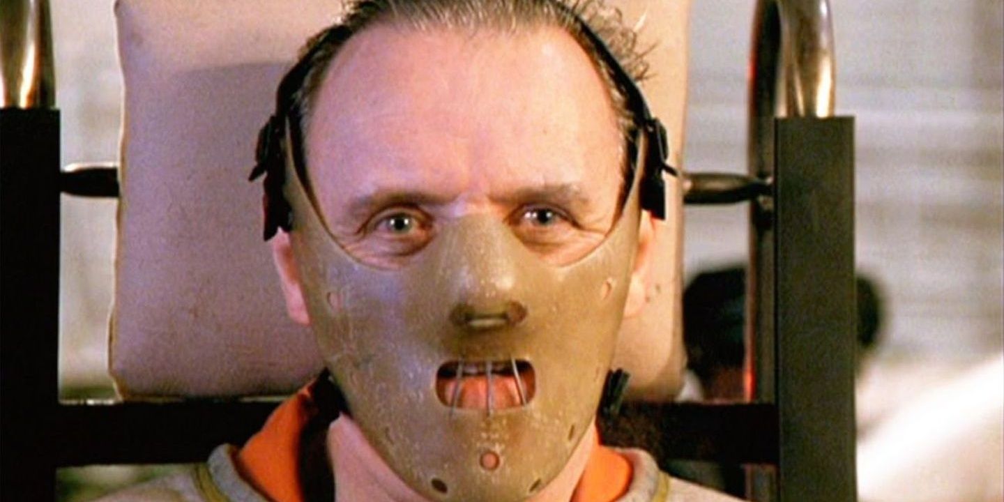 Hannibal Lecter tied up with the mask on 
