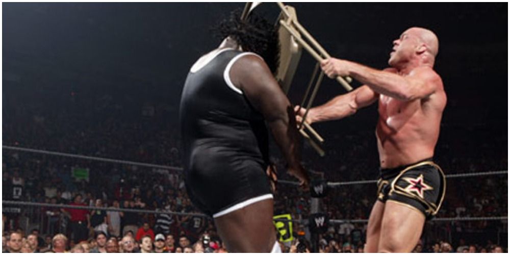 Kurt Angle hitting Mark Henry with a chair at Royal Rumble 2006