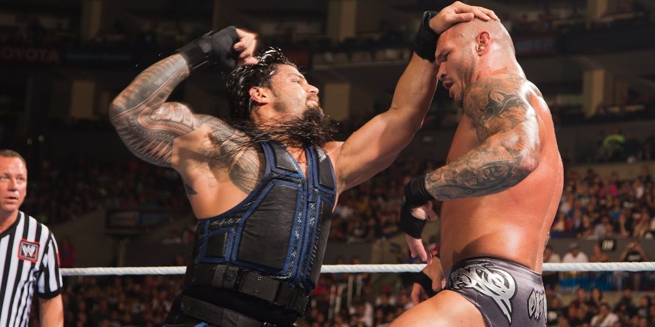 Roman Reigns punching Randy Orton at SummerSlam 