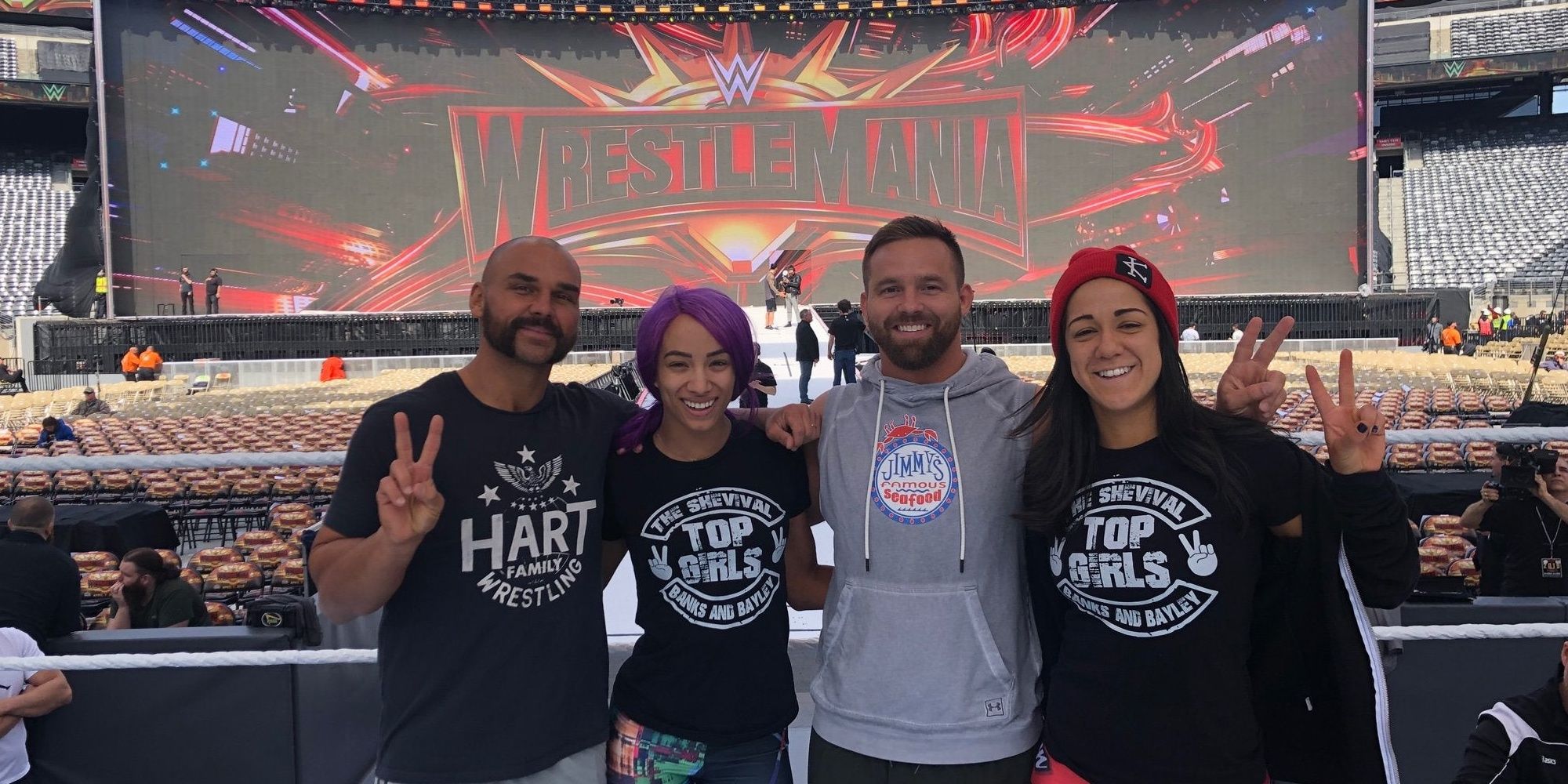 Bayley and Sasha Banks with The Revival at WrestleMania