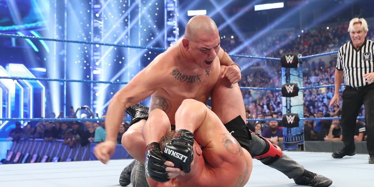 Cain Velasquez tackling Brock Lesnar
