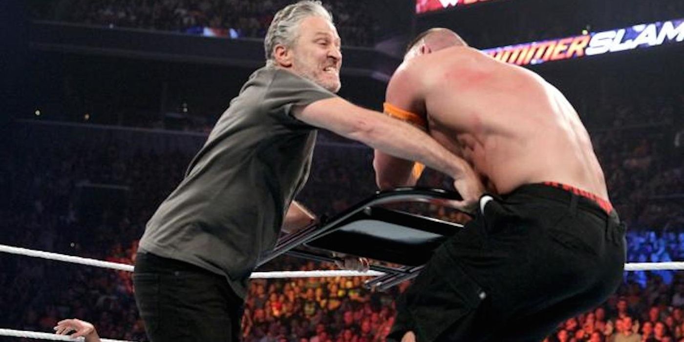 Jon Stewart hits John Cena with a chair
