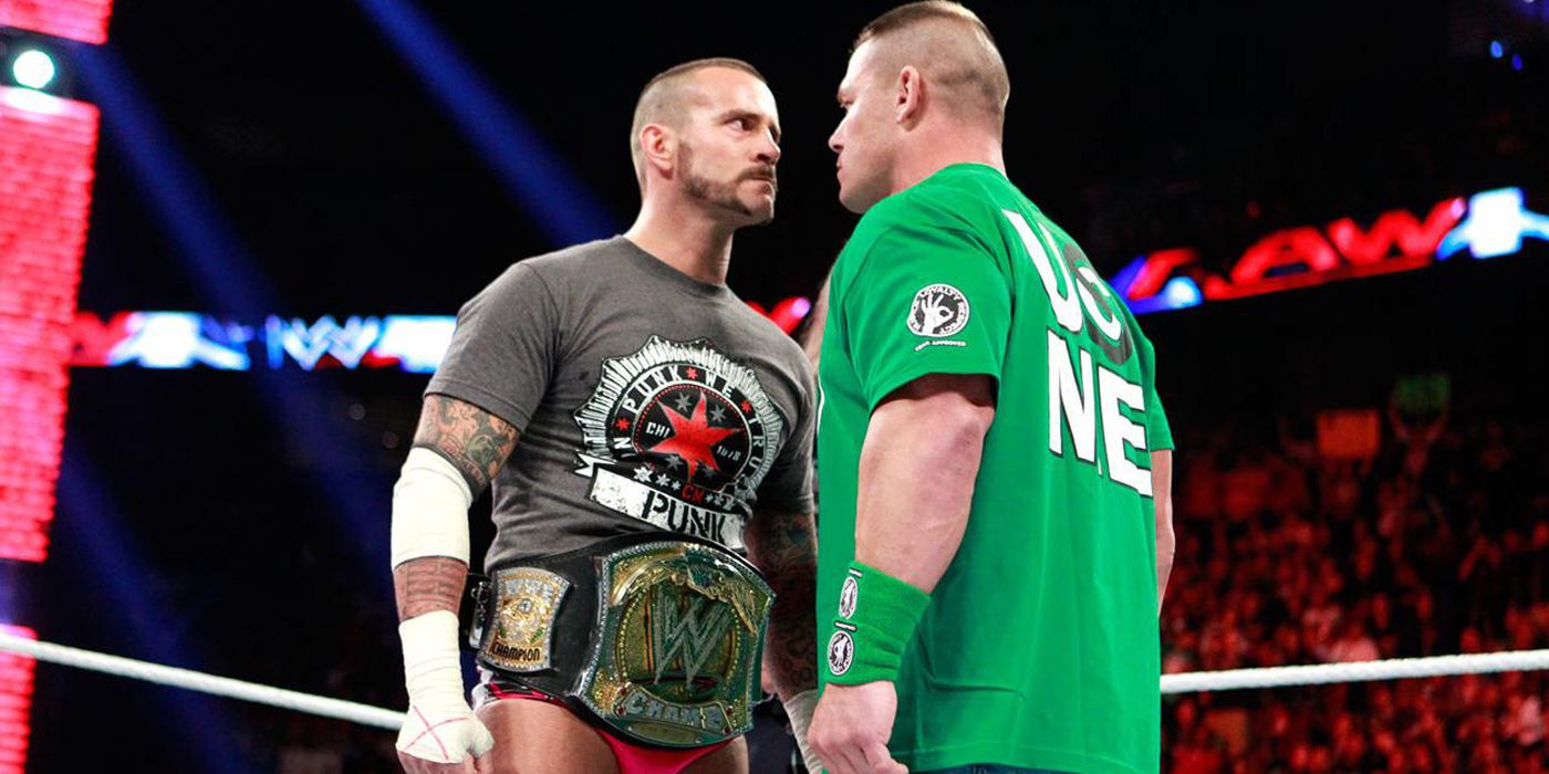 CM Punk facing off with John Cena in WWE.