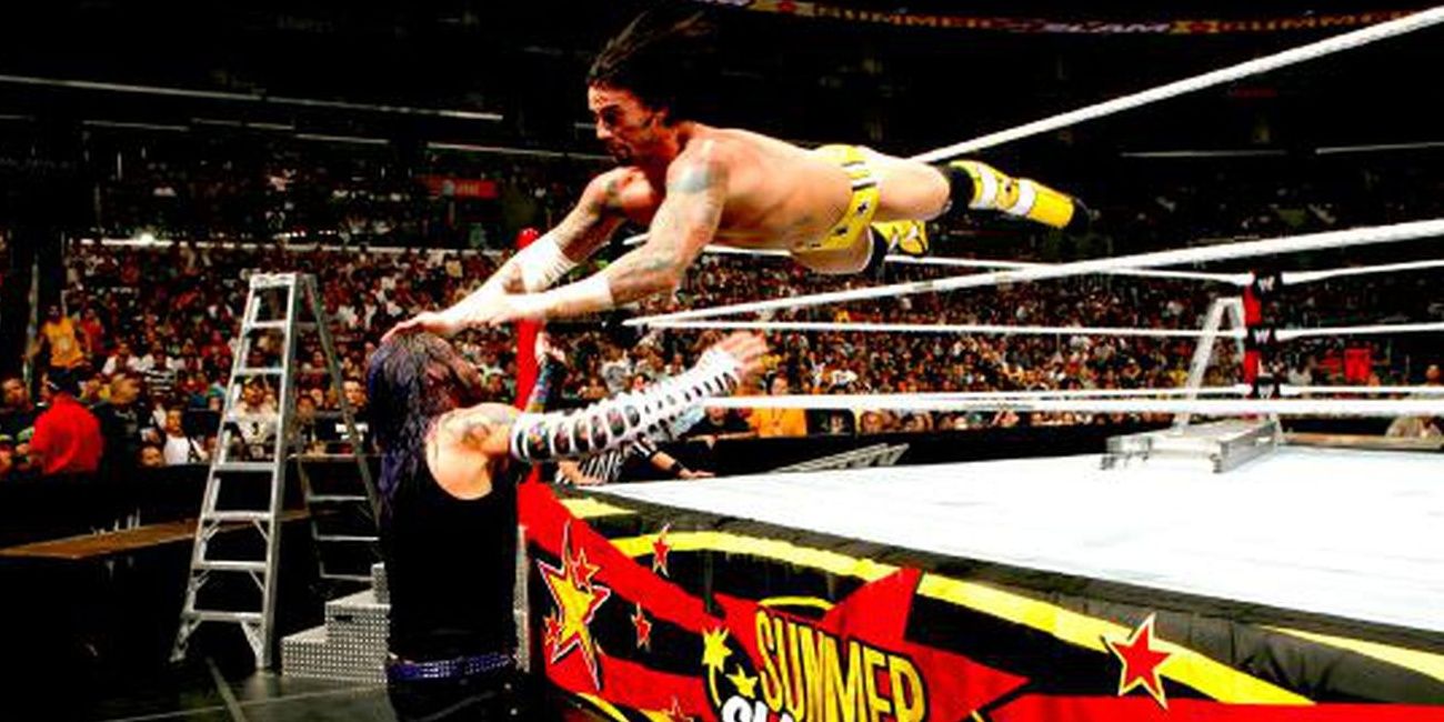 CM Punk hits a suicide dive to Jeff Hardy Cropped