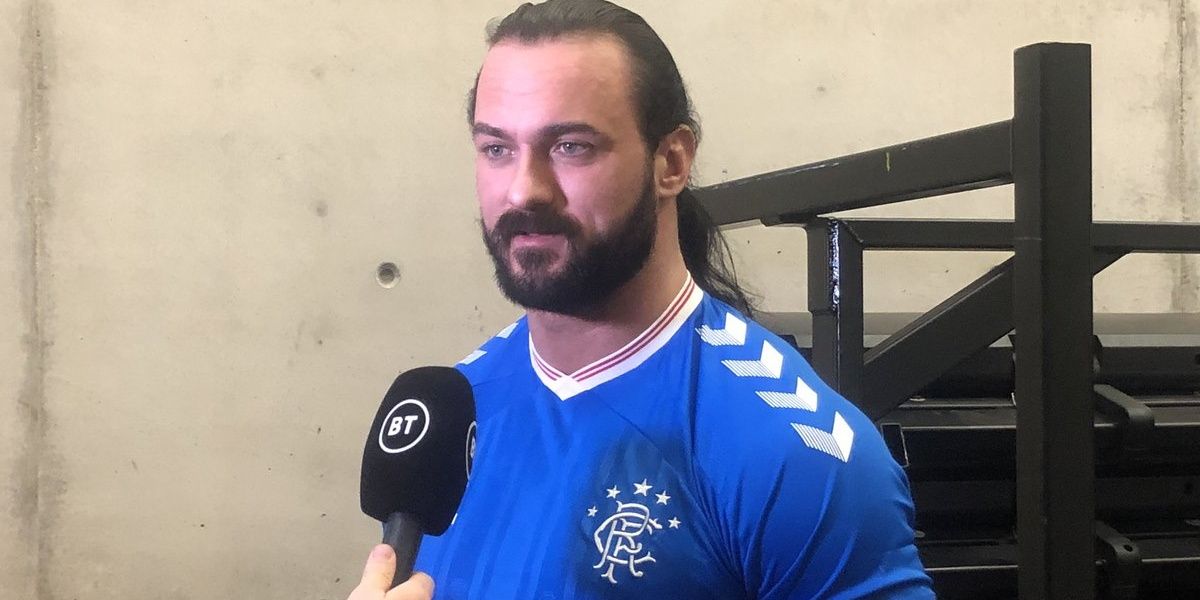 Drew McIntyre with a Rangers shirt on Cropped