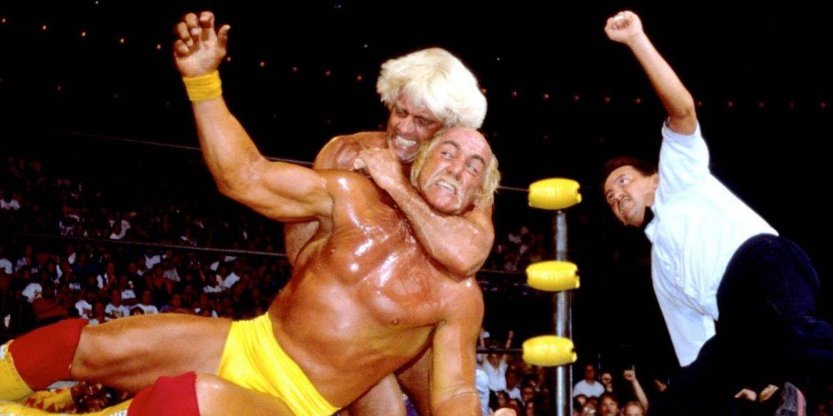 Flair locks a defiant Hogan in a headlock doing an encounter the two had.
