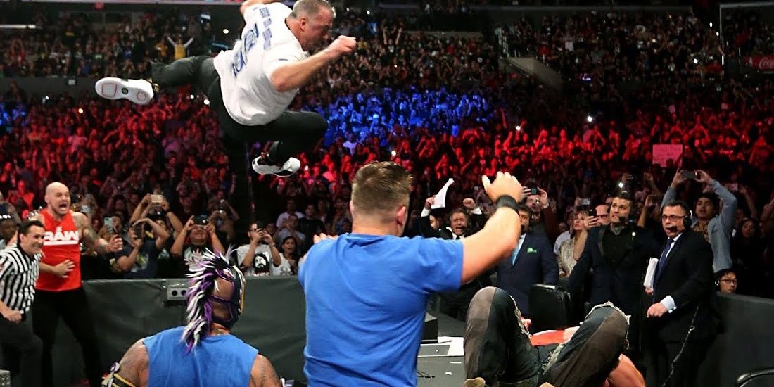 Shane McMahon dives to the announce table Cropped