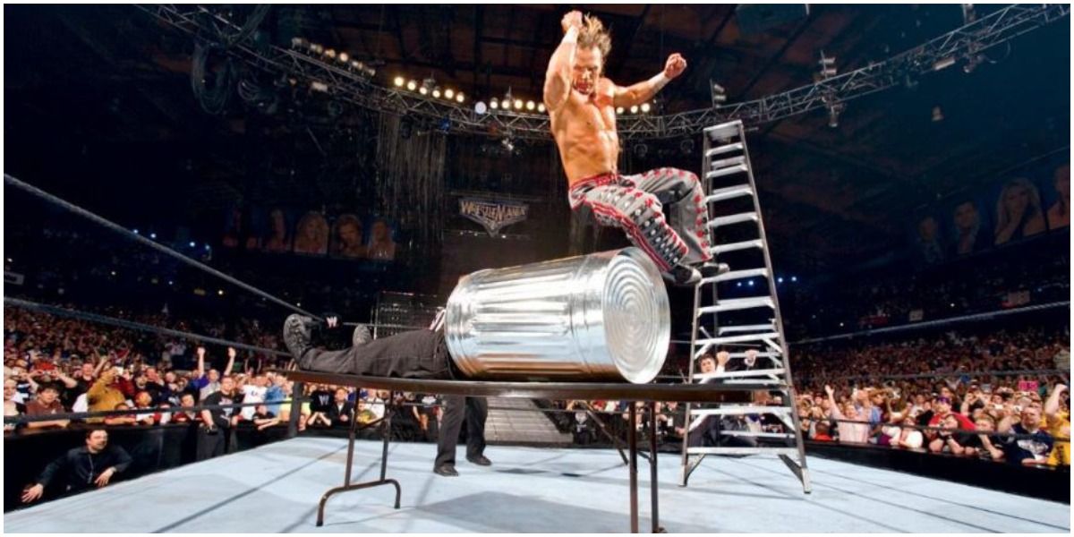 Shawn Michaels jumping on Vince McMahon