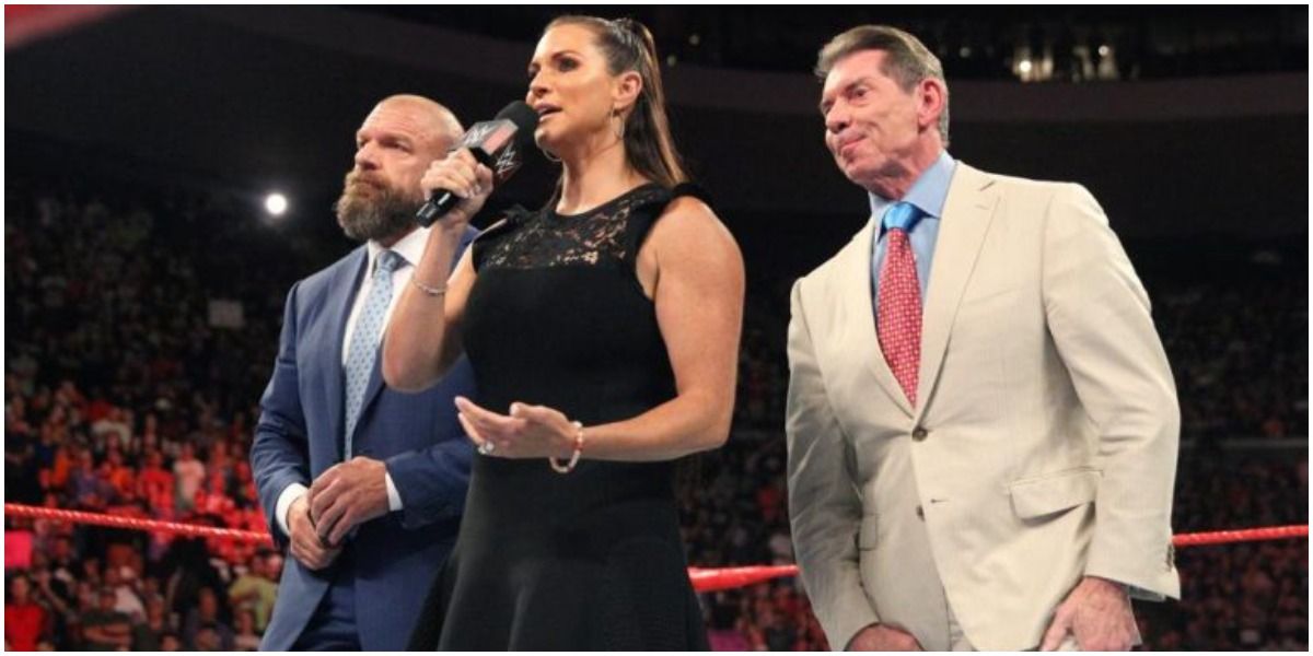 Triple H and Stephanie McMahon in ring with Vince McMahon