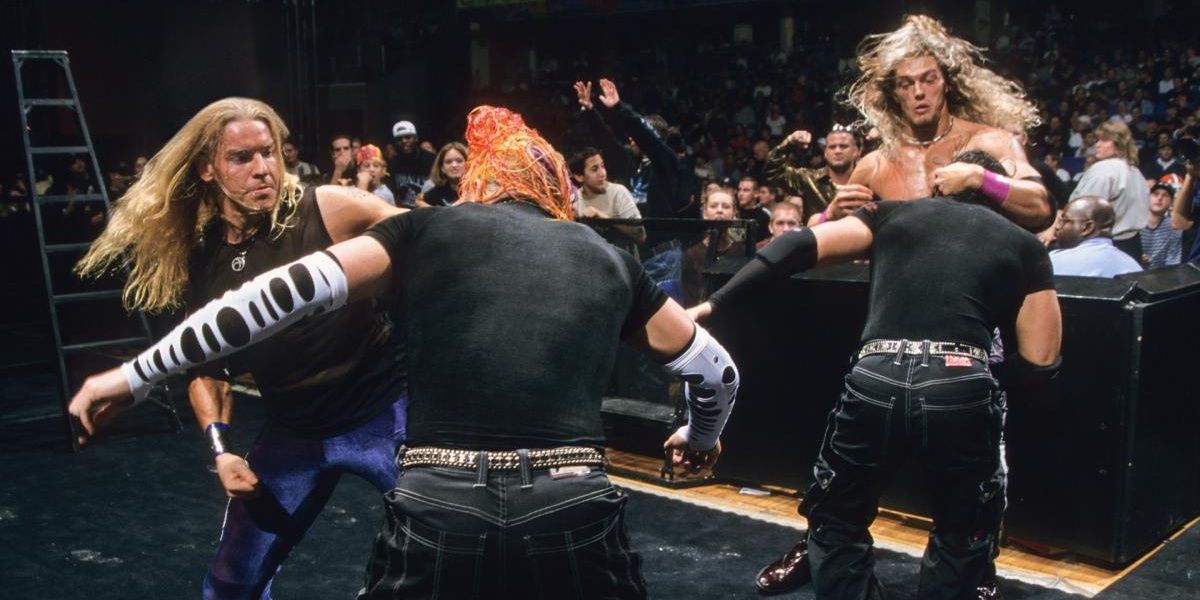 Hardy Boyz brawling with Edge and Christian at ringside 