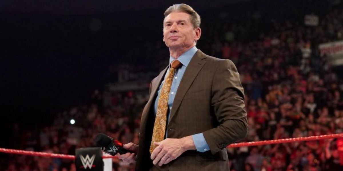 vince mcmahon in the ring with a mic