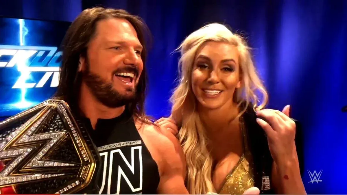 AJ Styles WWE Champion and Charlotte Flair backstage