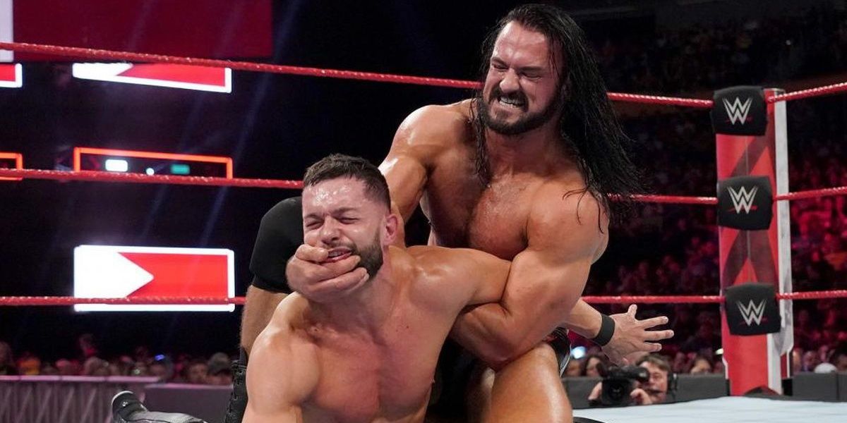 Drew McIntyre and Finn Balor inside the ring competing Cropped