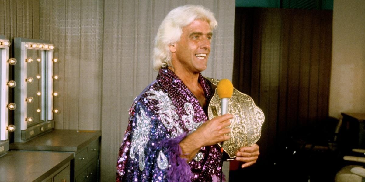 Ric Flair holding the big gold belt