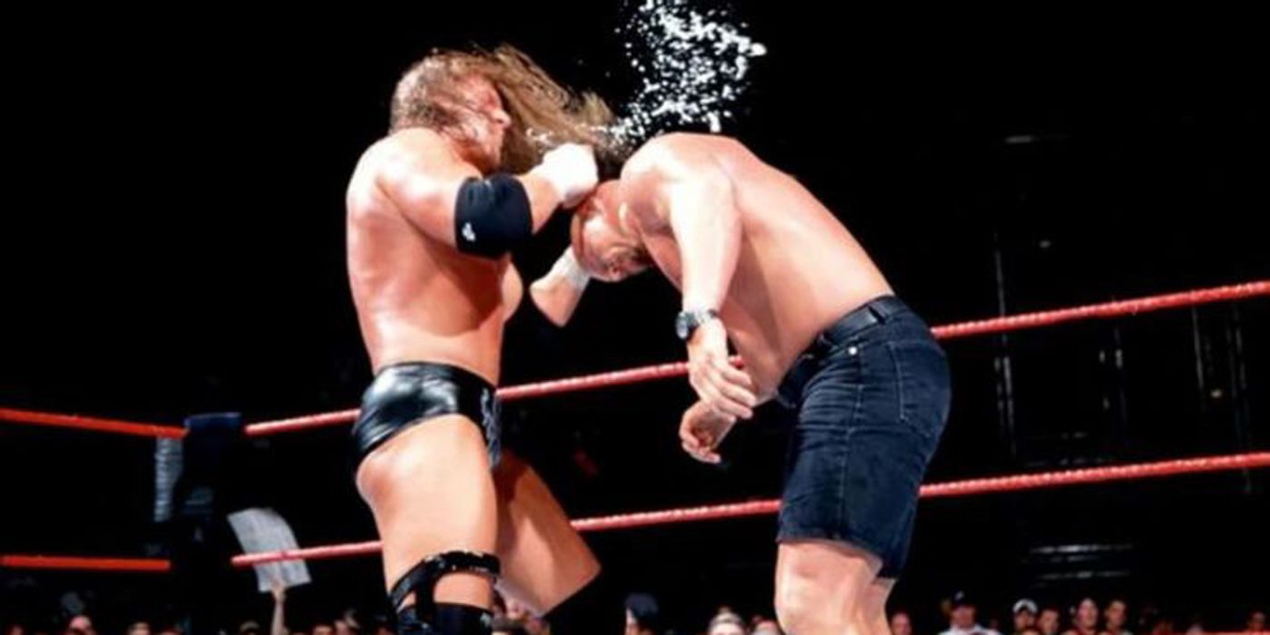 Triple H attacking Stone Cold Steve Austin in WWE