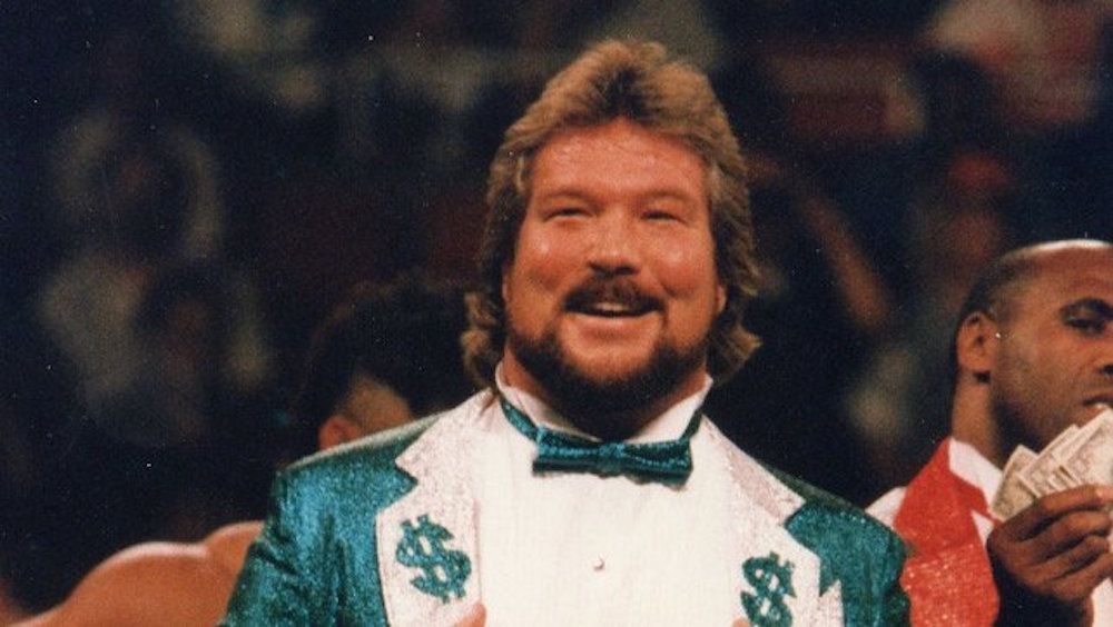 Ted DiBiase wearing a green suit