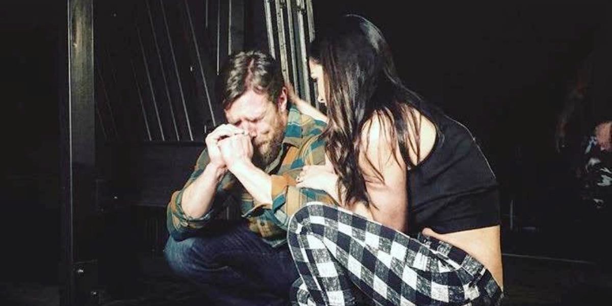 Brie Bella consoling Daniel Bryan bckstage