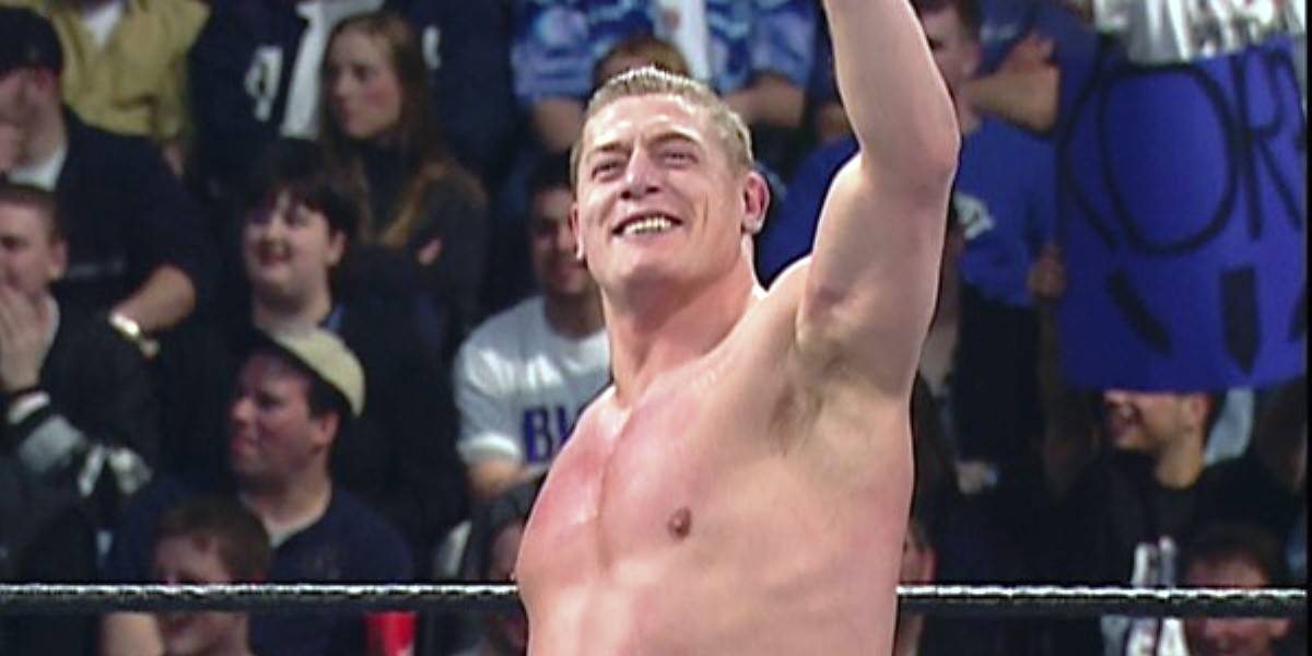 Regal, smirking obliviously, waves to the audience.