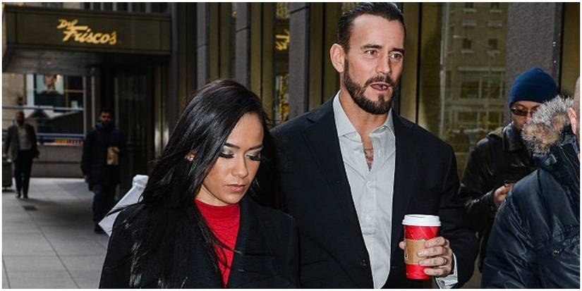 AJ Lee and CM Punk in suits
