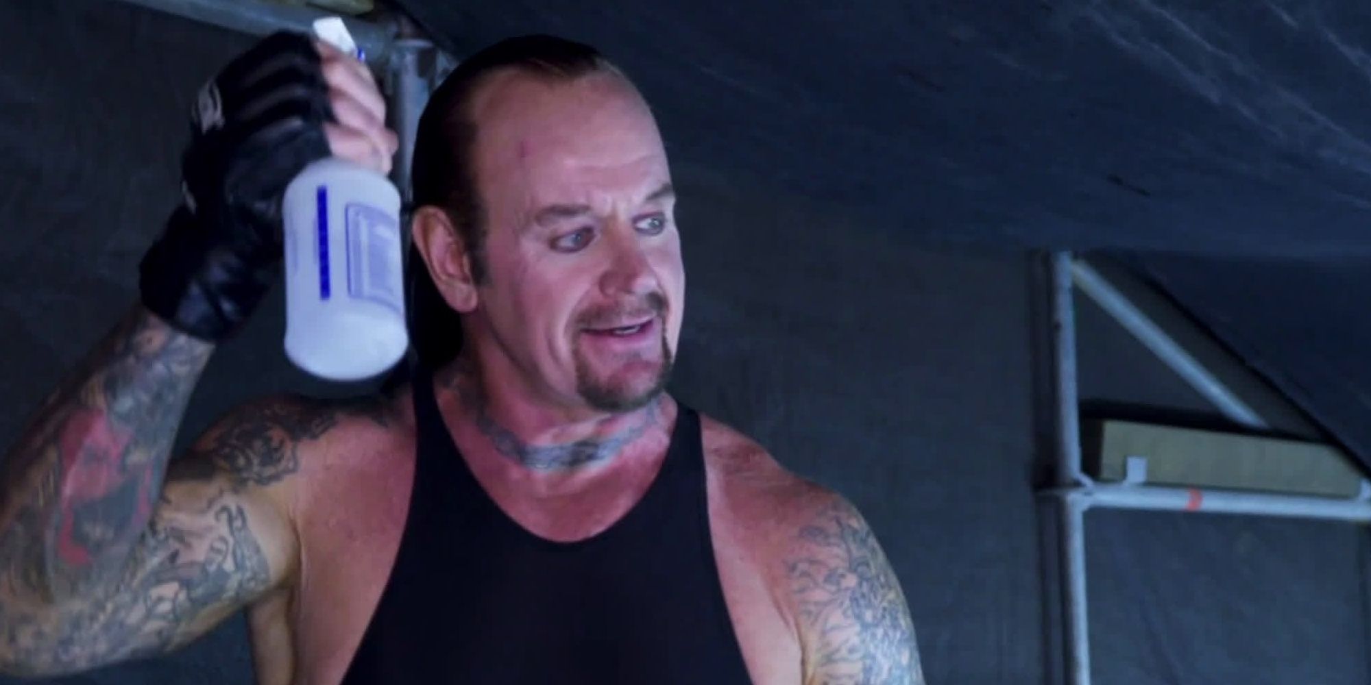 Undertaker spraying his hair Cropped