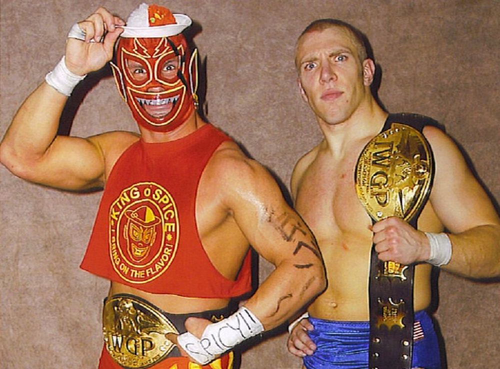 Curry Man and American Dragon (Bryan Danielson) as IWGP Junior Heavyweight Tag Team Champions