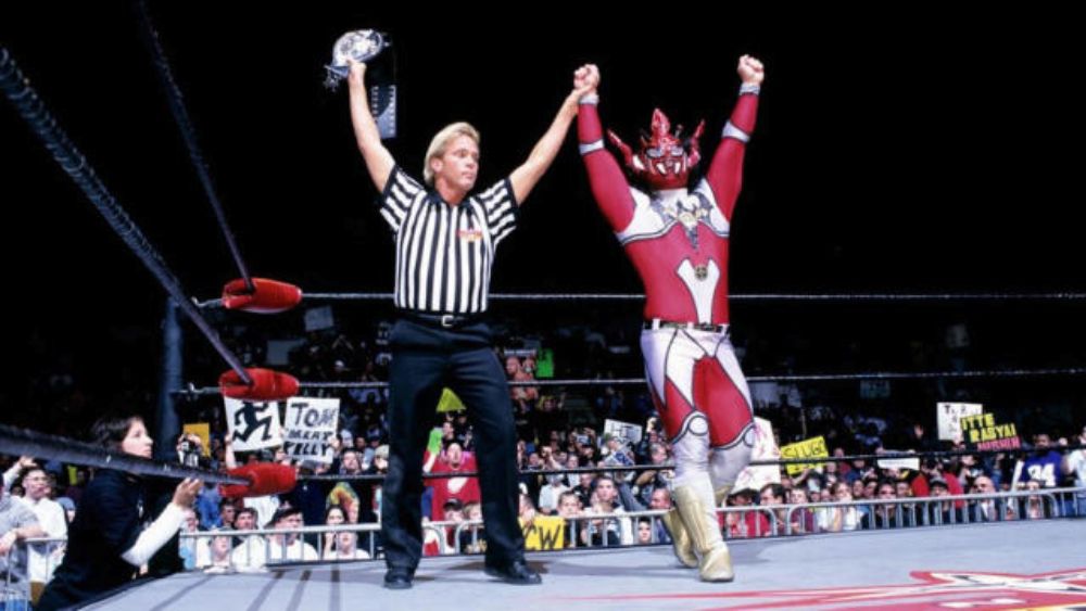 Jushin Thunder Liger with referee Charles Robinson in WCW