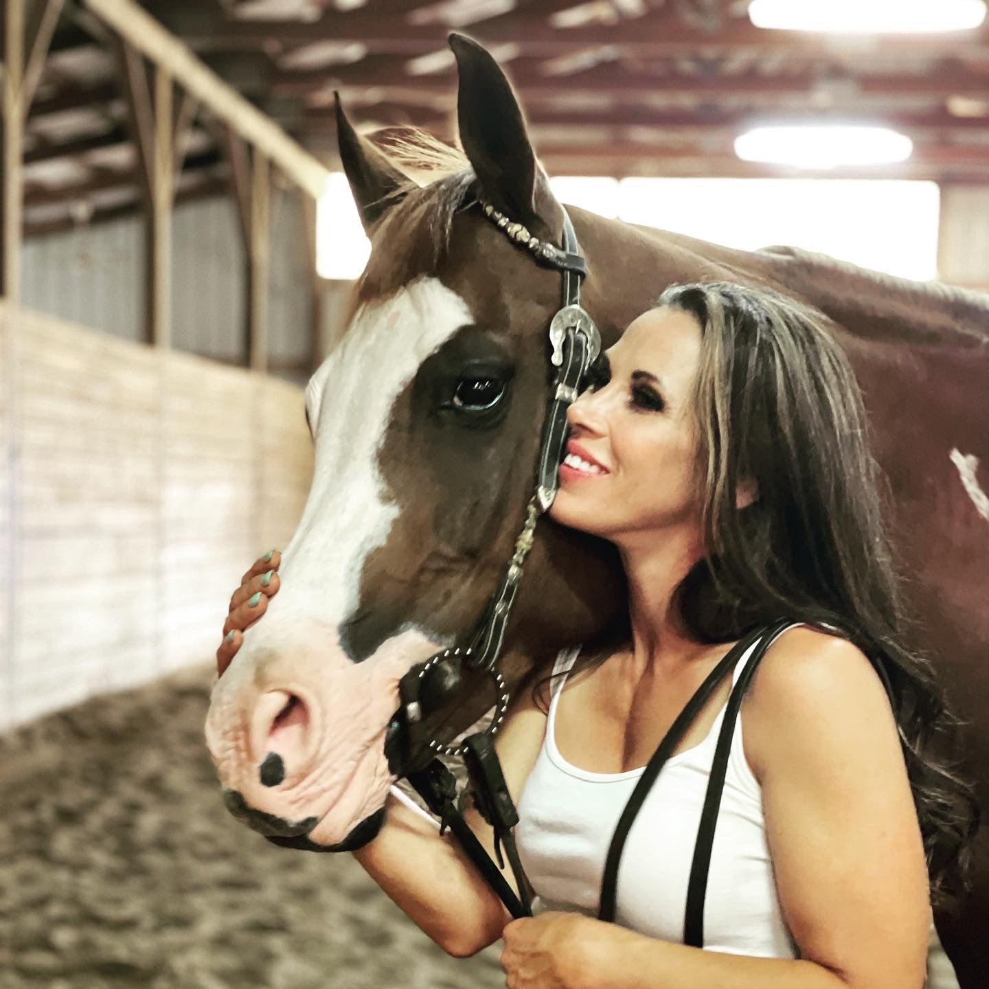 Mickie James with a horse