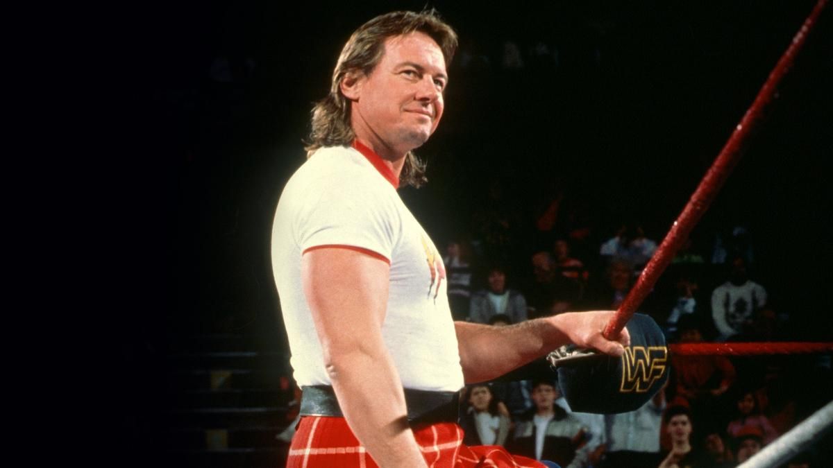 Roddy Piper standing on the apron