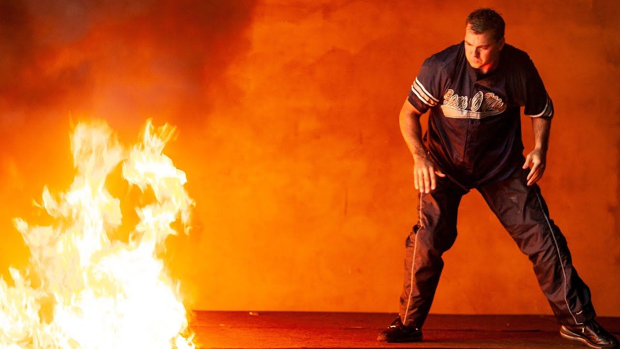 Shane McMahon throws Kane into fire