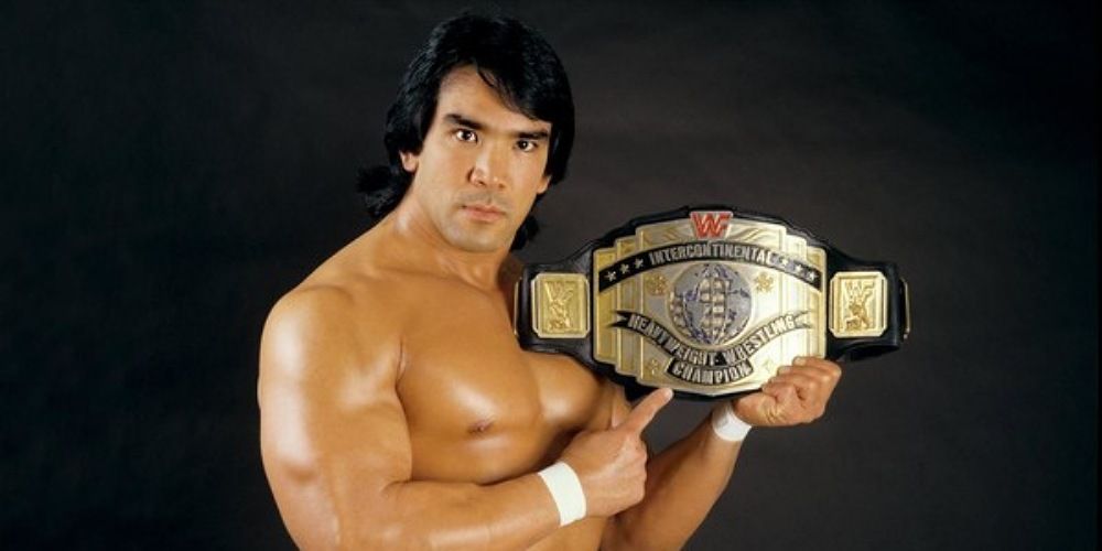 Ricky Steamboat holding up the WWE Intercontinental Championship