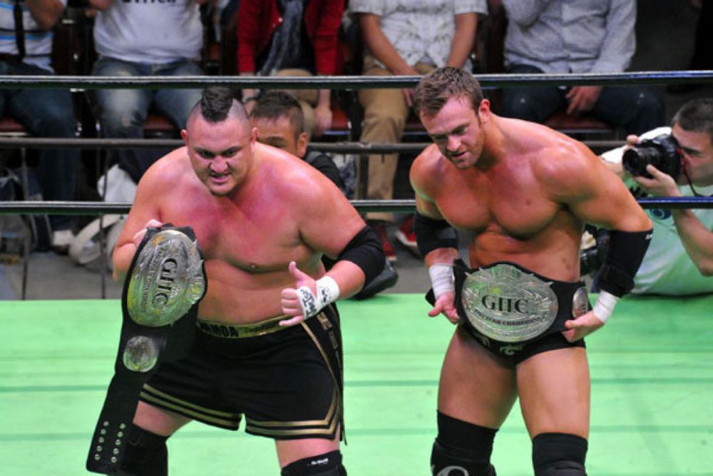 Samoa Joe and Magnus (a.k.a. Nick Aldis) as GHC Tag Team Champions in Pro Wrestling NOAH