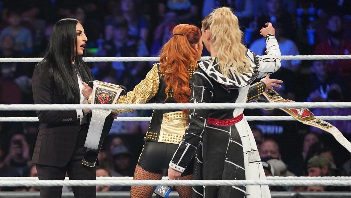 Becky Lynch and Charlotte Flair title exchange