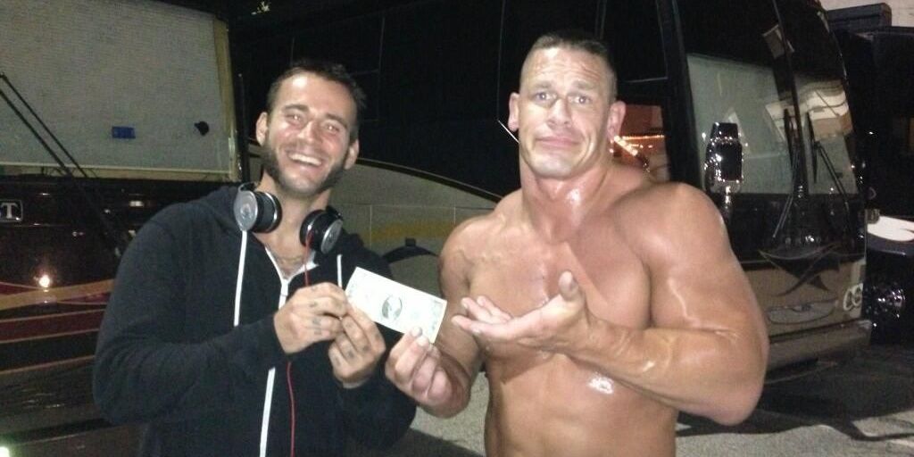 CM Punk and John Cena exchanging money