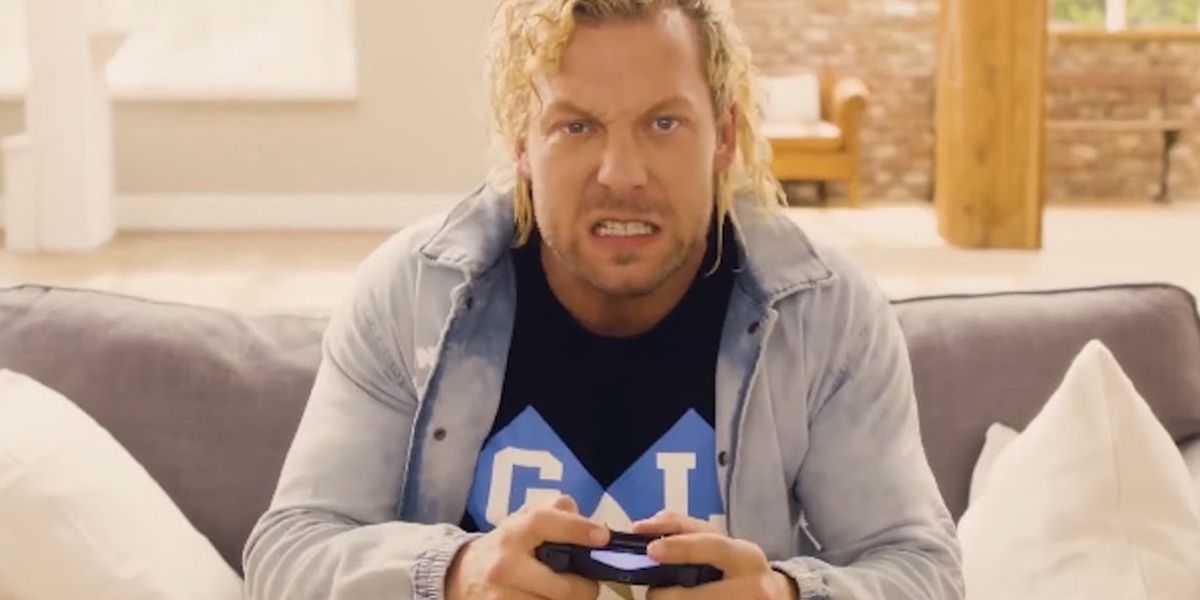 Kenny Omega playing a video game 